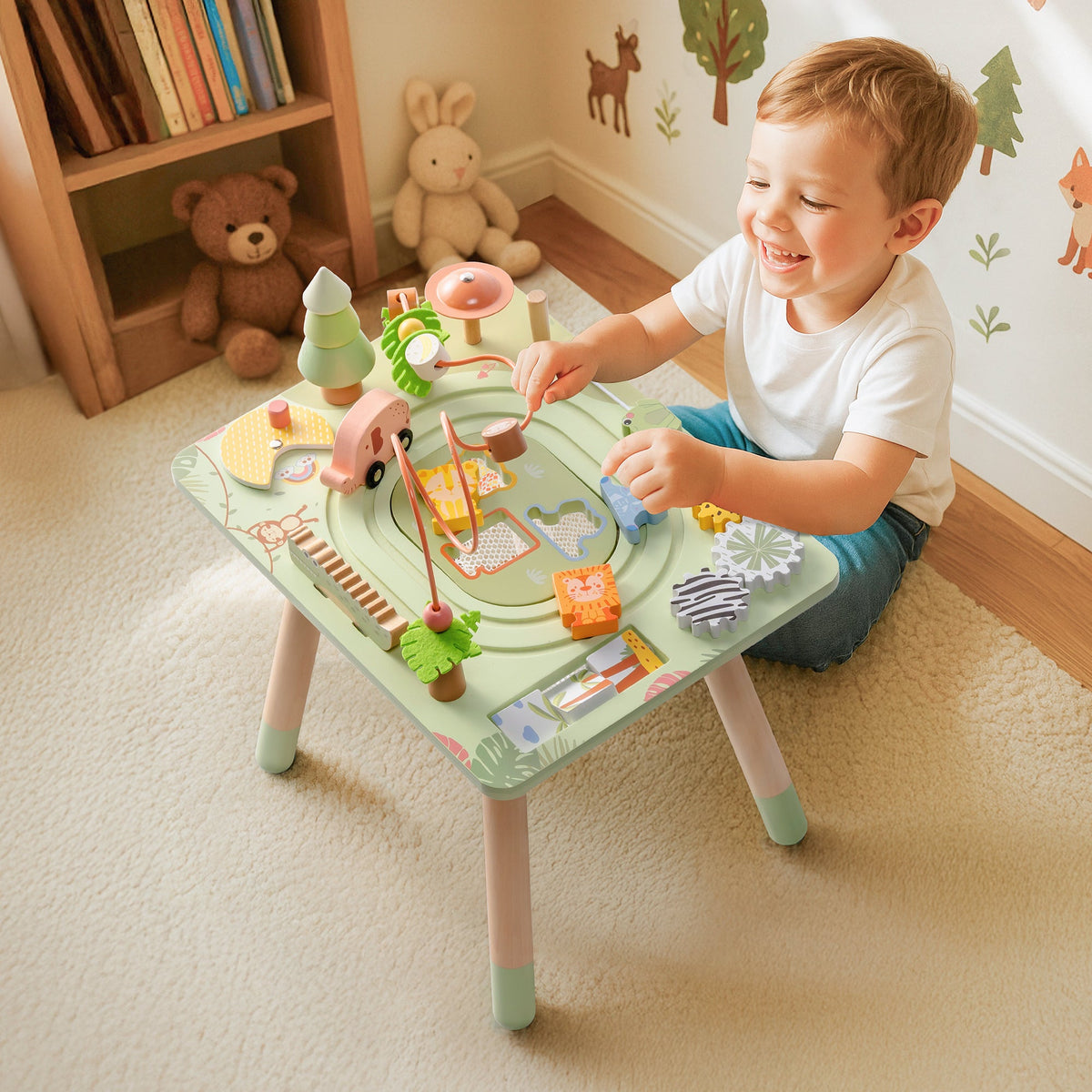 Young boy playing with ROBUD Wooden 11 in 1 Rainforest Activity Table in a bright forest-themed nursery with wooden decor