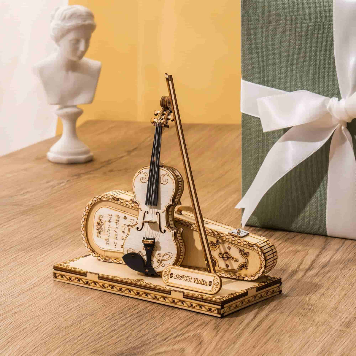 ROKR Violin Capriccio TG604K 3D wooden musical instrument model, lifestyle scene on a wooden desk