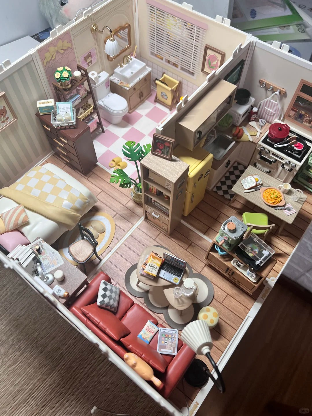 Rolife fairy tale wooden dollhouse top-down view showing multiple detailed miniature rooms with furniture kitchen living