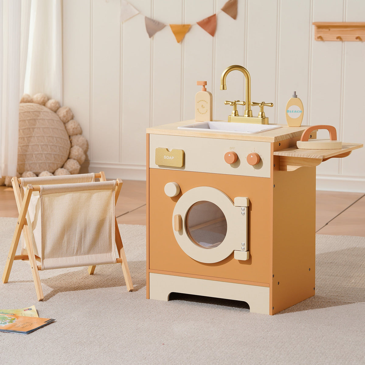 ROBUD Wooden Caramel Laundry Playset styled in a bright Scandinavian nursery with bunting flags and linen laundry basket