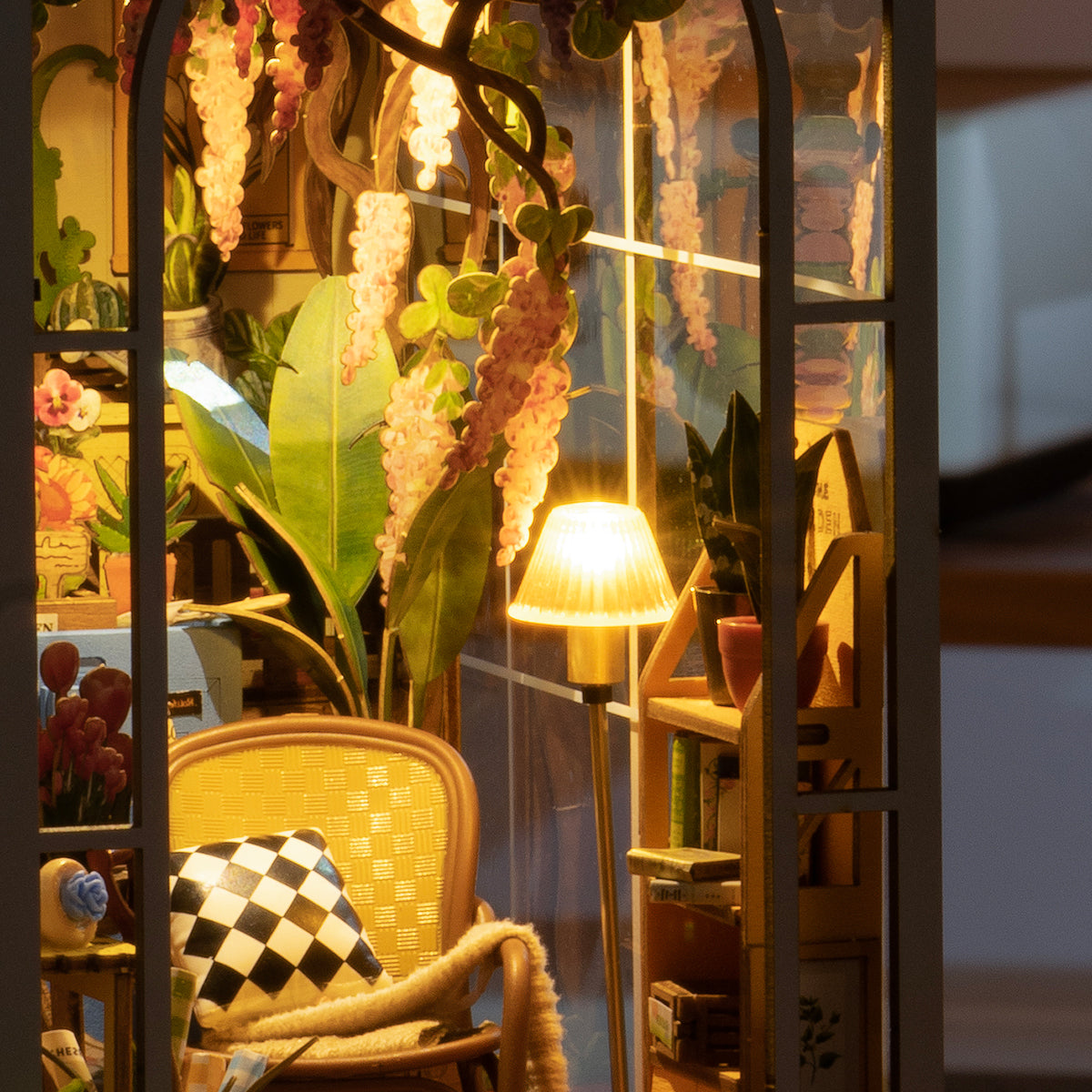 Rolife miniature scene close up of wooden chair, table lamp, plants and hanging wisteria in vintage interior