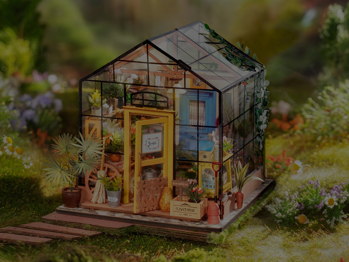 ROKR Dream Gift Factory mechanical puzzle showing a detailed red and cream toy factory building with rotating carousel cylinder and work line