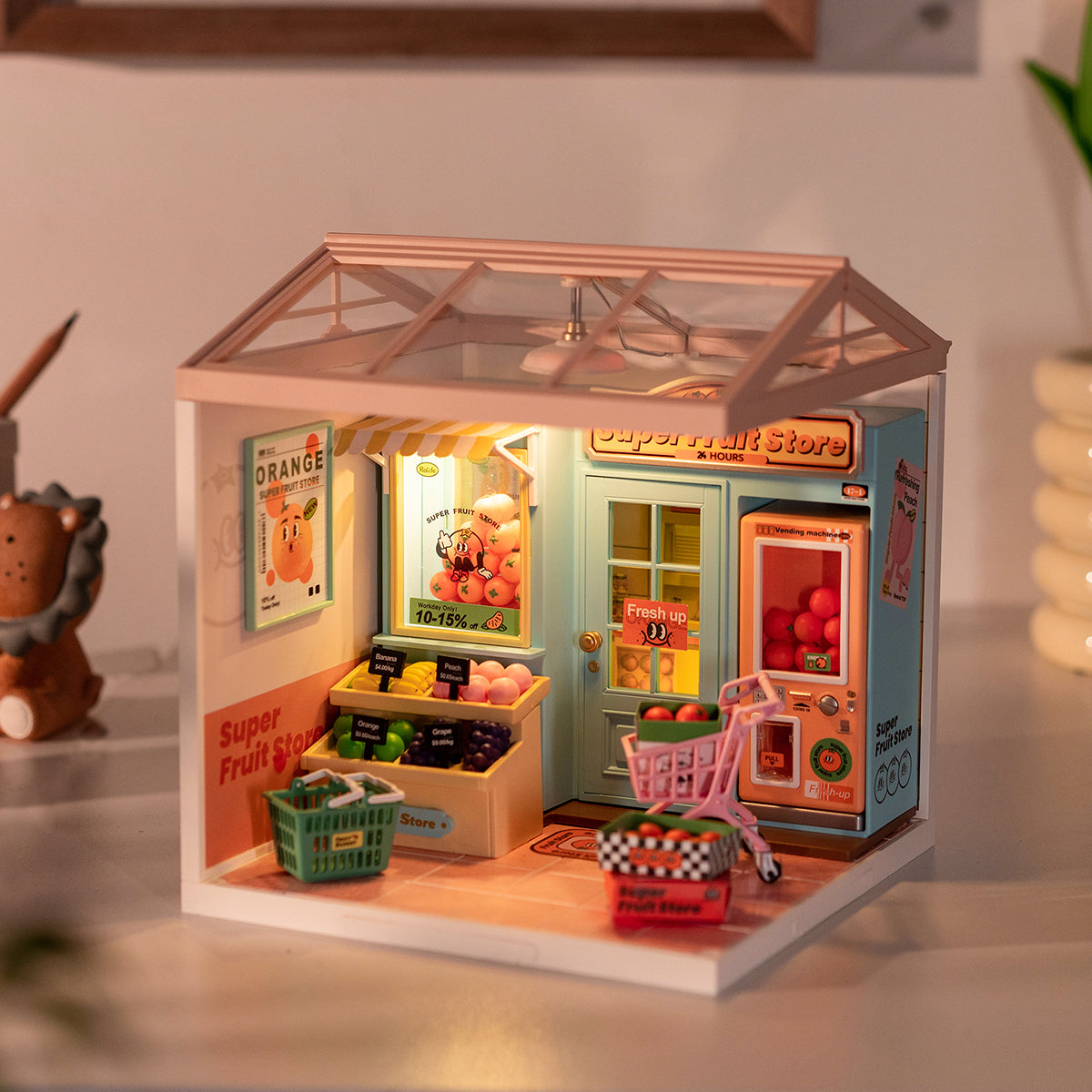 Rolife Super Fruit Store DW003 completed miniature with a teal shopfront, produce bins, pink shopping cart and vending
