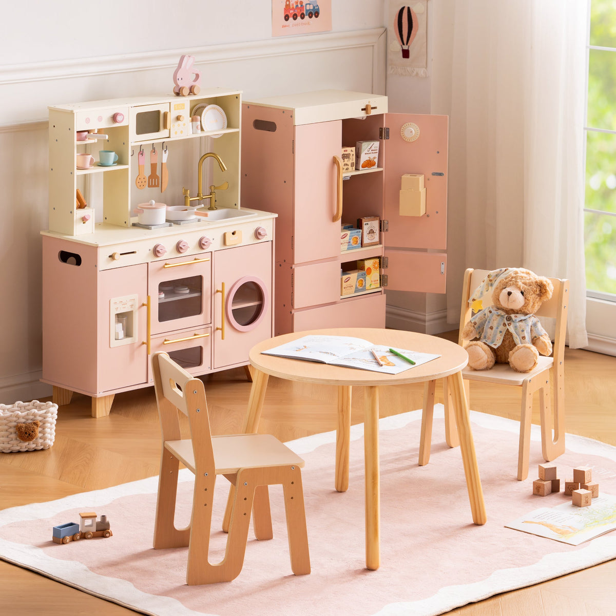 ROBUD Glowwood pink table and chairs set showing the full dining furniture from a wide angle with kitchen accessories nearby.