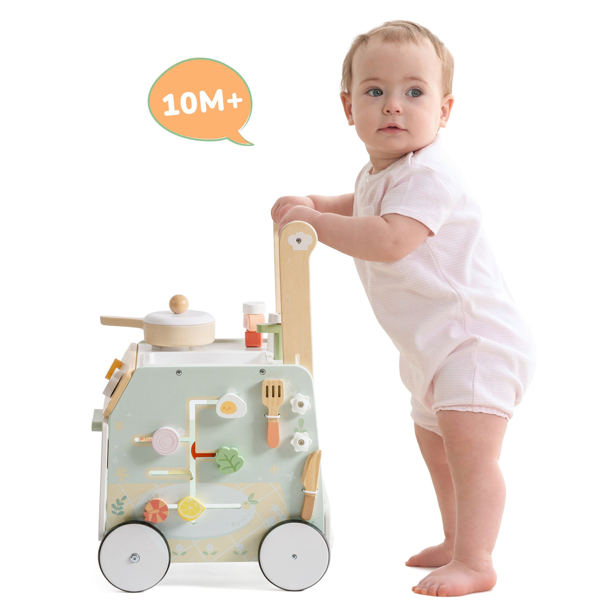 ROBUD Spring Countryside green wooden baby walker with open oven door showing toy bread and pastries inside, food pieces scattered around on a cream rug