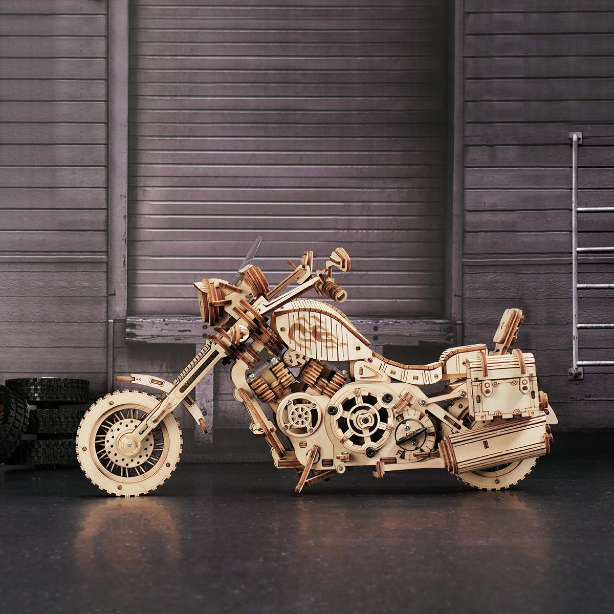 ROKR Cruiser Motorcycle wooden model side view against a moody grey industrial shutter background