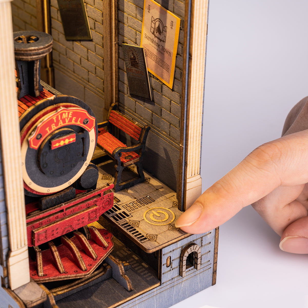 Rolife Time Travel book nook close up showing red steam locomotive emerging from a brick arched tunnel