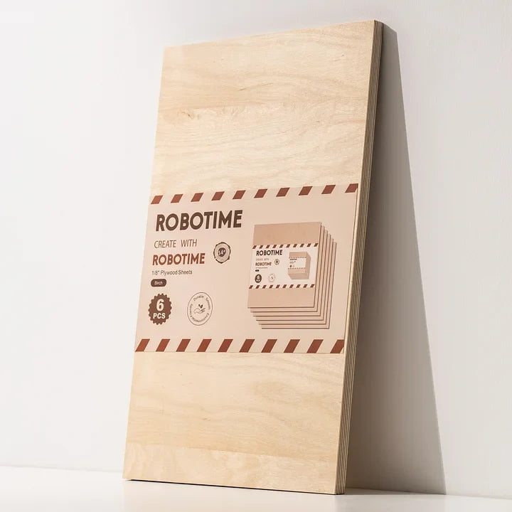 Robotime plywood sheet package showing branded label at lower right, pale birch board leaning against white wall