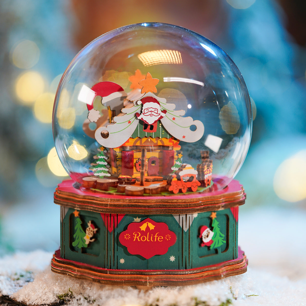 Rolife Christmas town music box with a clear dome, red base, and festive figures inside.