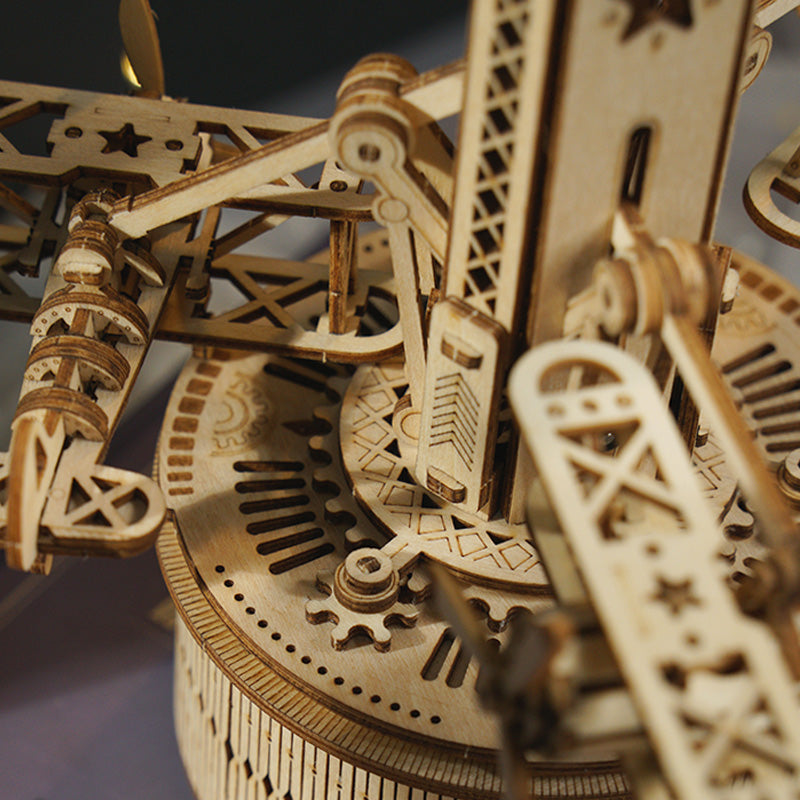 ROKR Airplane Control Tower mechanical detail showing gear teeth and carved wooden biplane body on lower platform