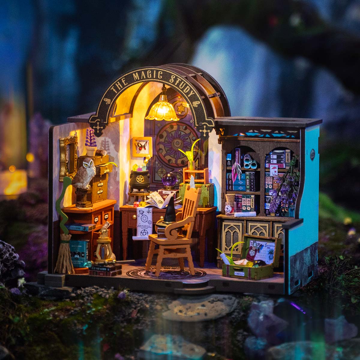 Rolife Magic Study miniature glows at night with shelves, books, and a curved doorway.