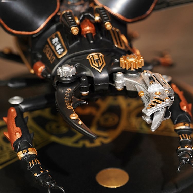 ROKR Storm Beetle MI03 close-up of articulated foreleg claws with copper joints and black body