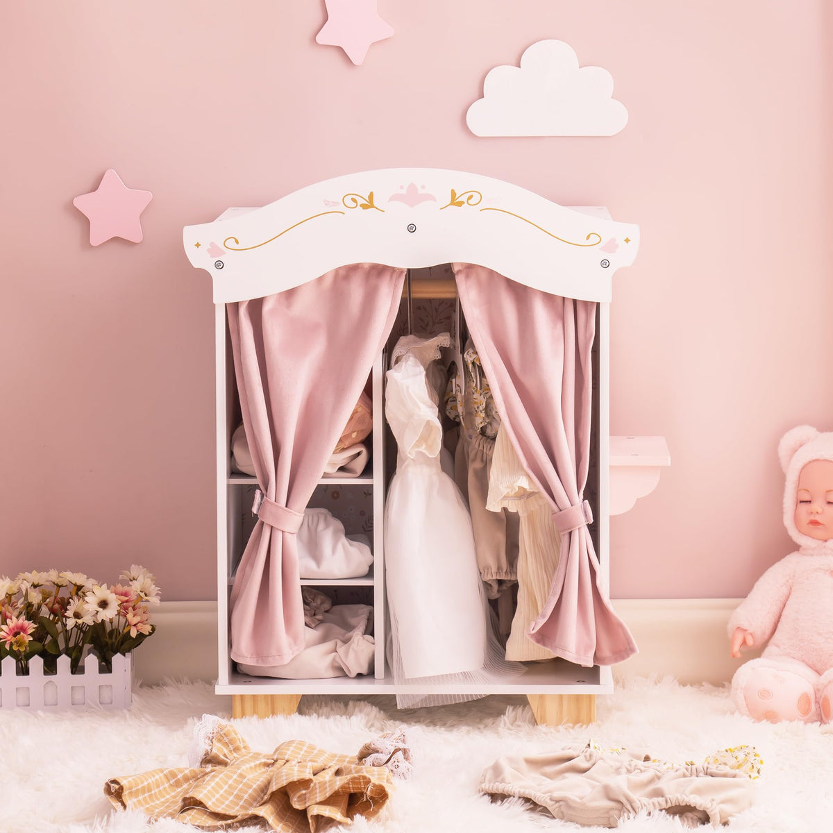 ROBUD wooden princess doll wardrobe with pink curtains open on a pastel pink wall, showing doll outfits neatly hung inside.