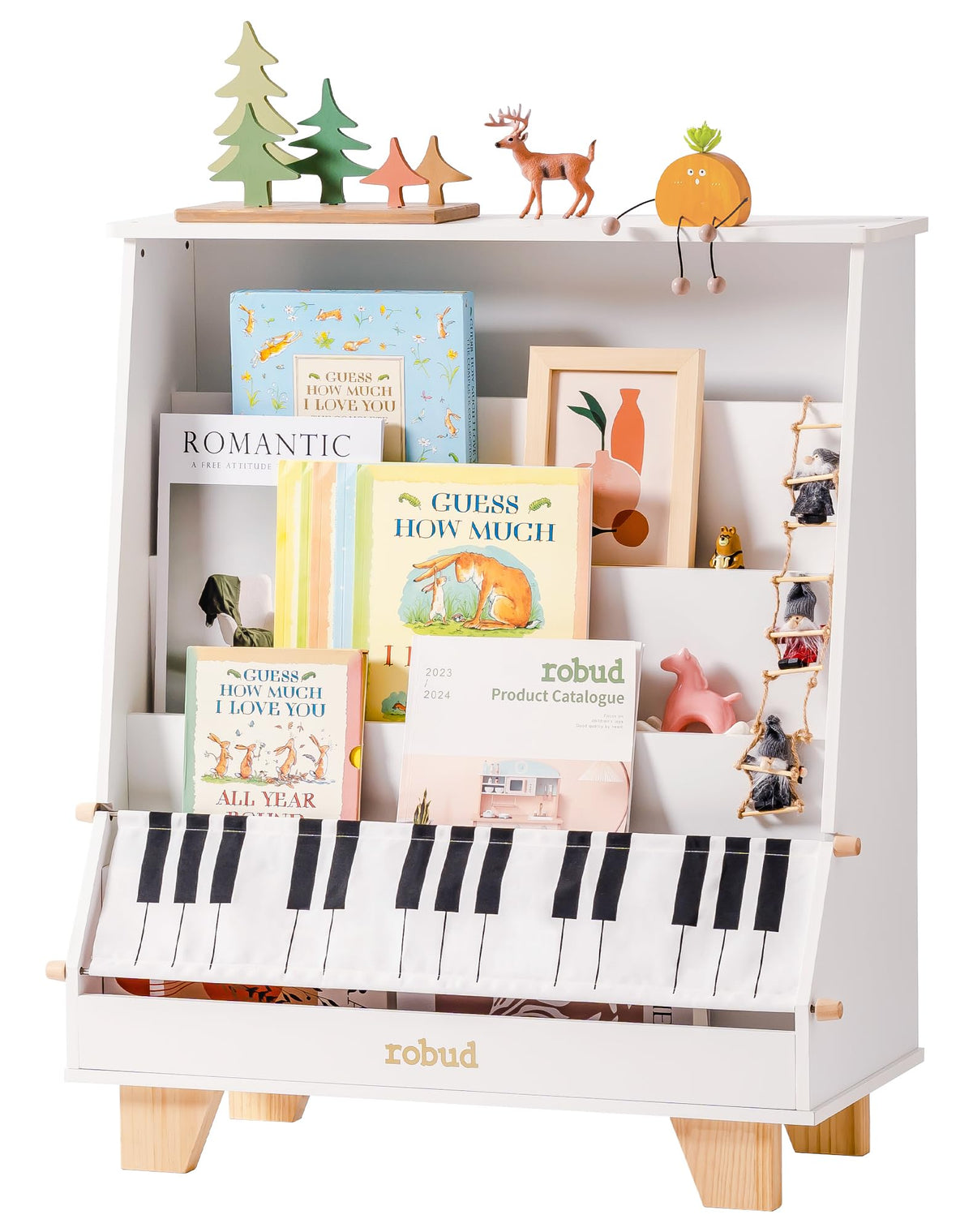 ROBUD Wooden Kids Bookshelf Piano white version front detail view showing the piano key pattern fabric storage pocket fully filled with colorful children's books and decorative side accessories