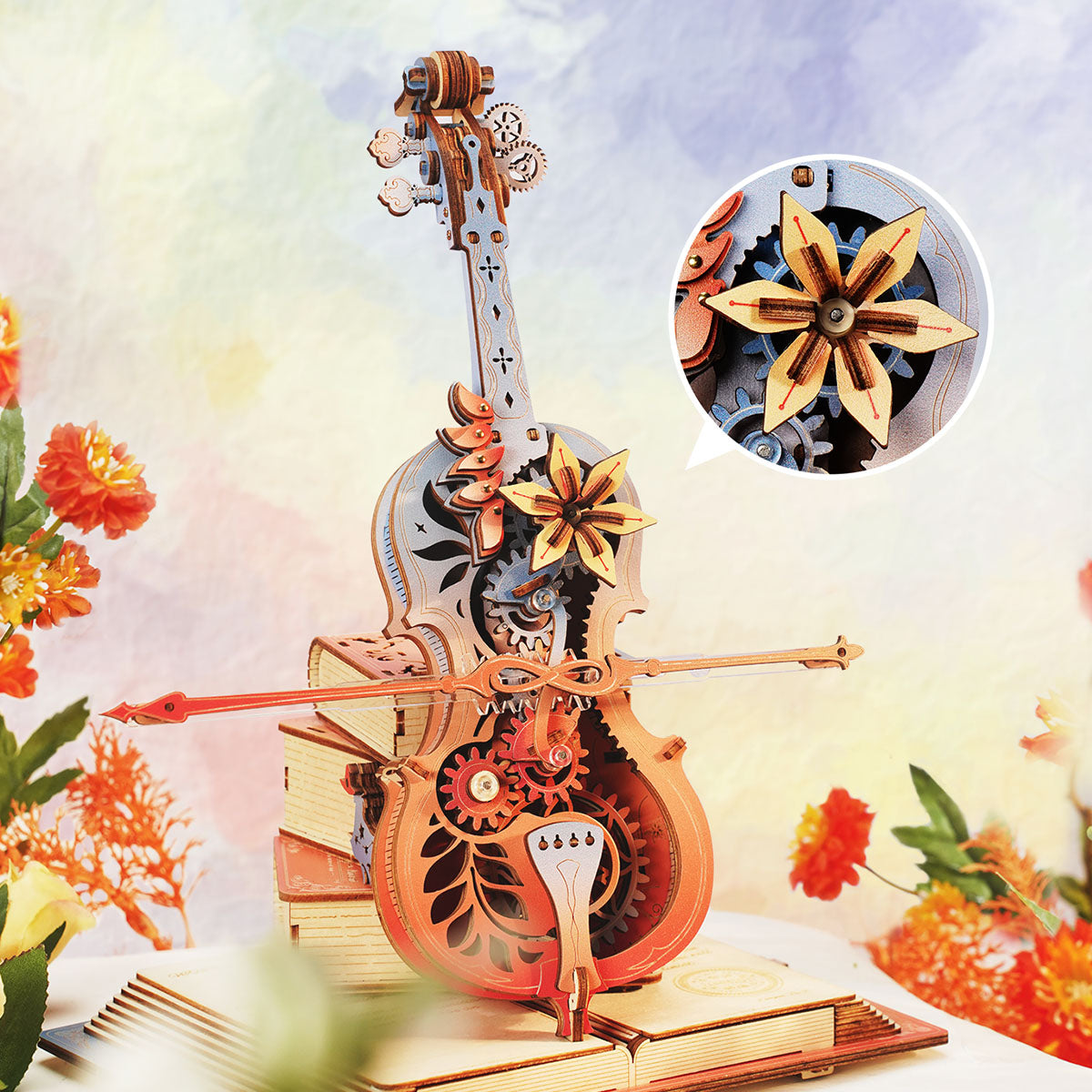 ROKR Symphony of Gorgeous Dreams AMK63M close-up of the spinning flower and blue gear mechanism inside the upper cello body with warm flower backdrop