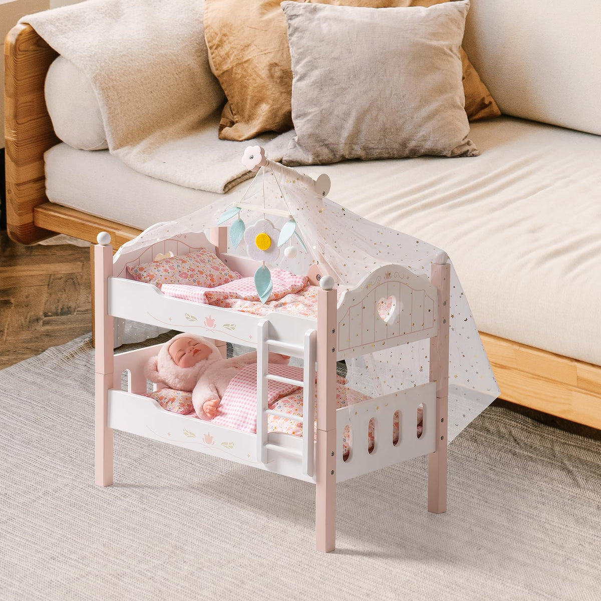 Two dolls rest in the ROBUD white wooden princess bunk bed with star canopy draped over the top bunk frame.