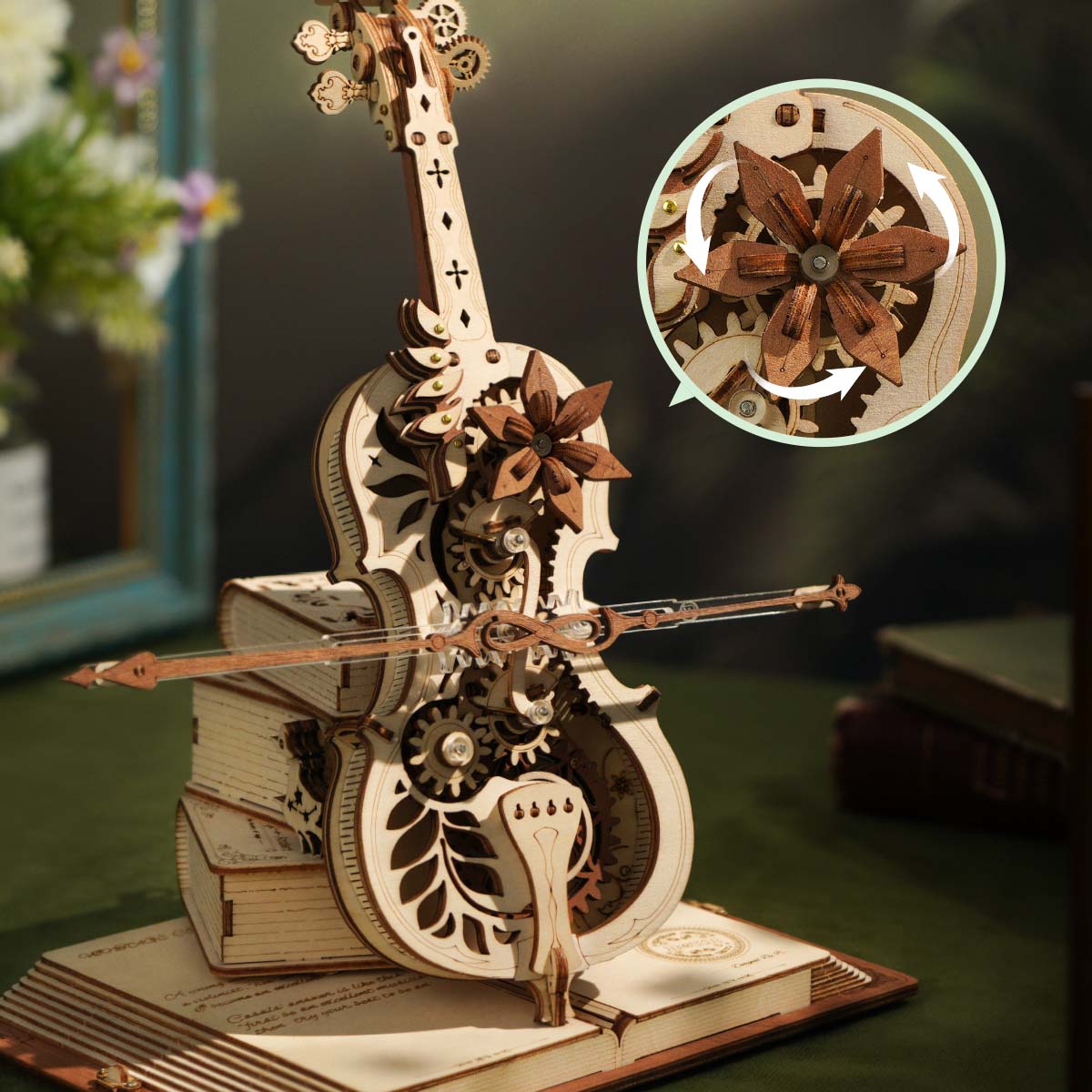 ROKR Magic Cello Mechanical Music Box AMK63 close-up of natural-wood cello body with rotating walnut flower gear and acrylic bow in action, circle inset showing gear detail