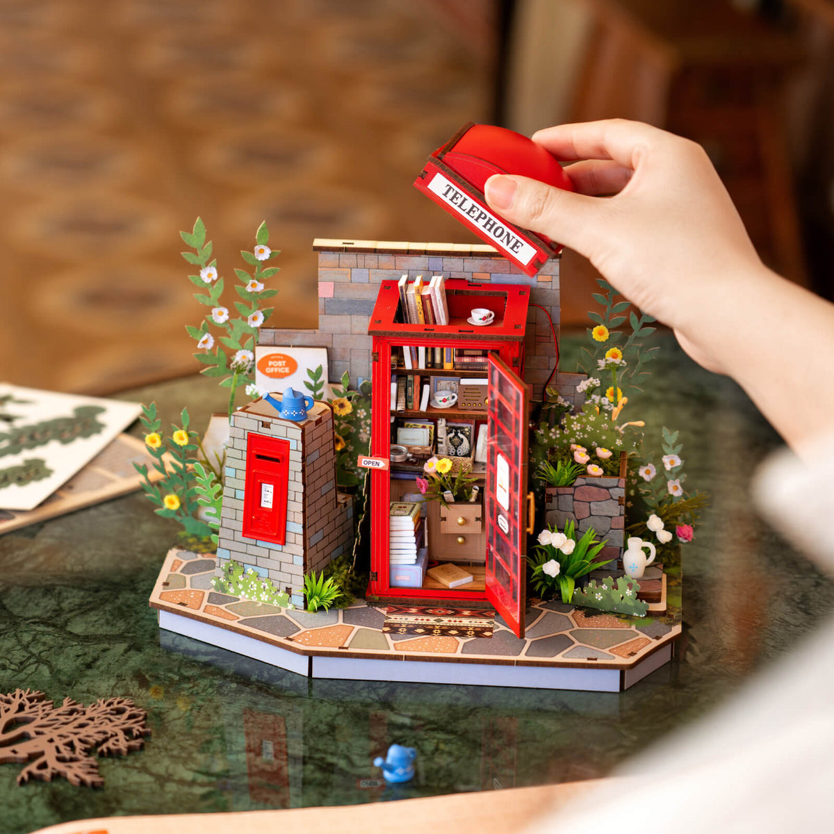 Rolife Blossom Book Booth 3D Wooden Puzzle TGS05 3D wooden puzzle model, styled lifestyle scene with model assembled