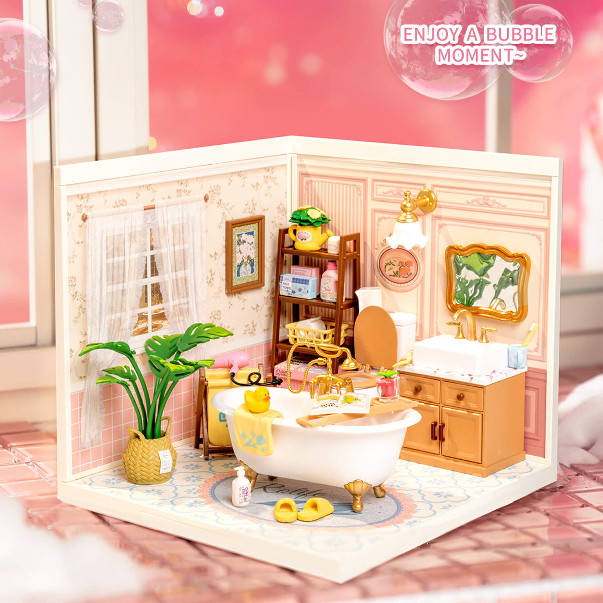 Rolife Pop Bubble Bathroom miniature shown in a clean square format with the pink bathroom interior fully visible including mirror, sink, and plant.
