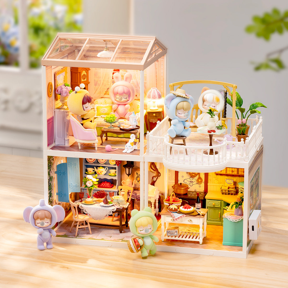 Rolife Holiday Tea Time DW023 multi-floor lit Nanci dollhouse exterior with character figurines placed around the glowing structure