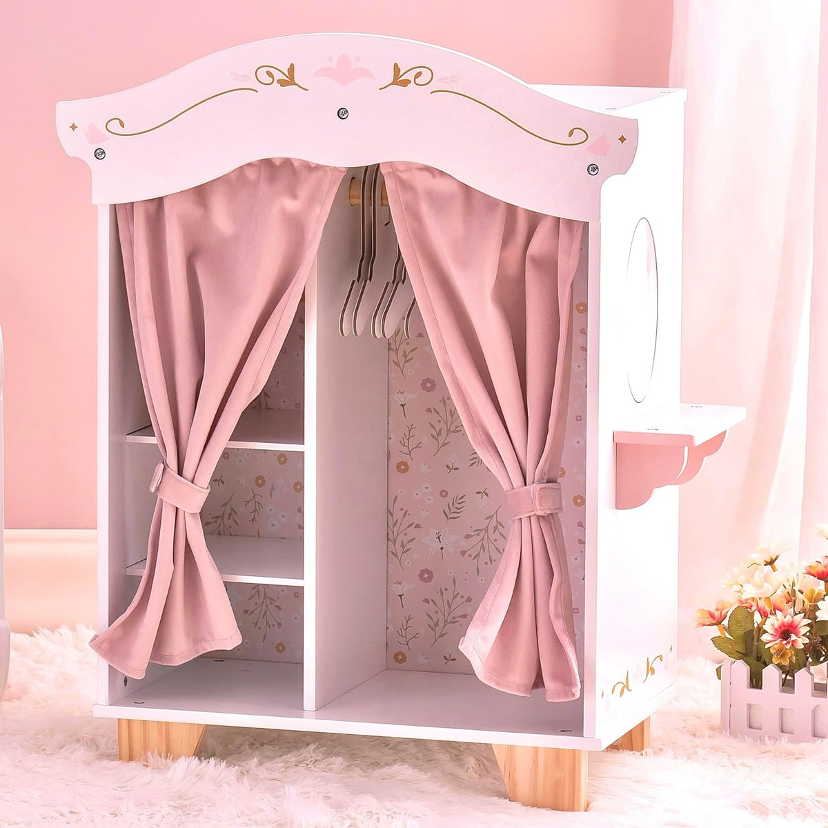 Robud doll wardrobe with pink curtains tied back showing internal shelf and hanging rod space