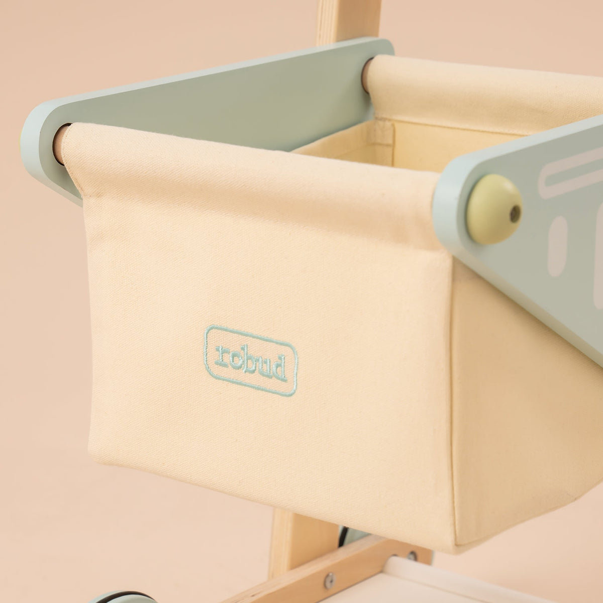 ROBUD wooden baby push walker WRP02 canvas storage compartment detail showing cream bin with logo embroidery and stitching