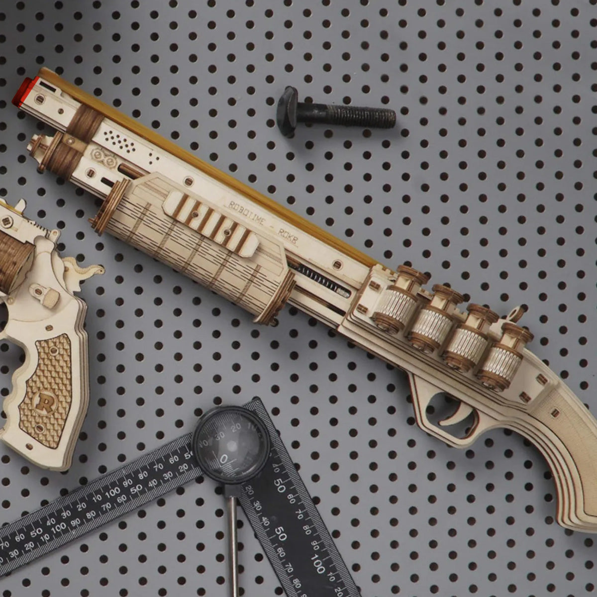 ROKR Terminator M870 Justice Guard Gun LQ501 3D wooden puzzle, front view on a neutral background