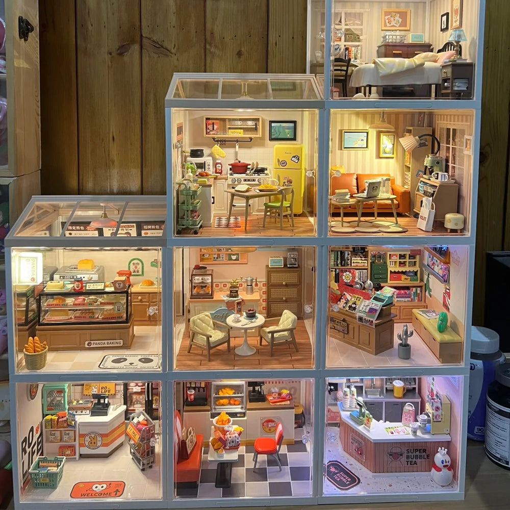 Rolife Super Creator stacked illuminated dollhouse rooms displaying multiple themed interior scenes side by side.