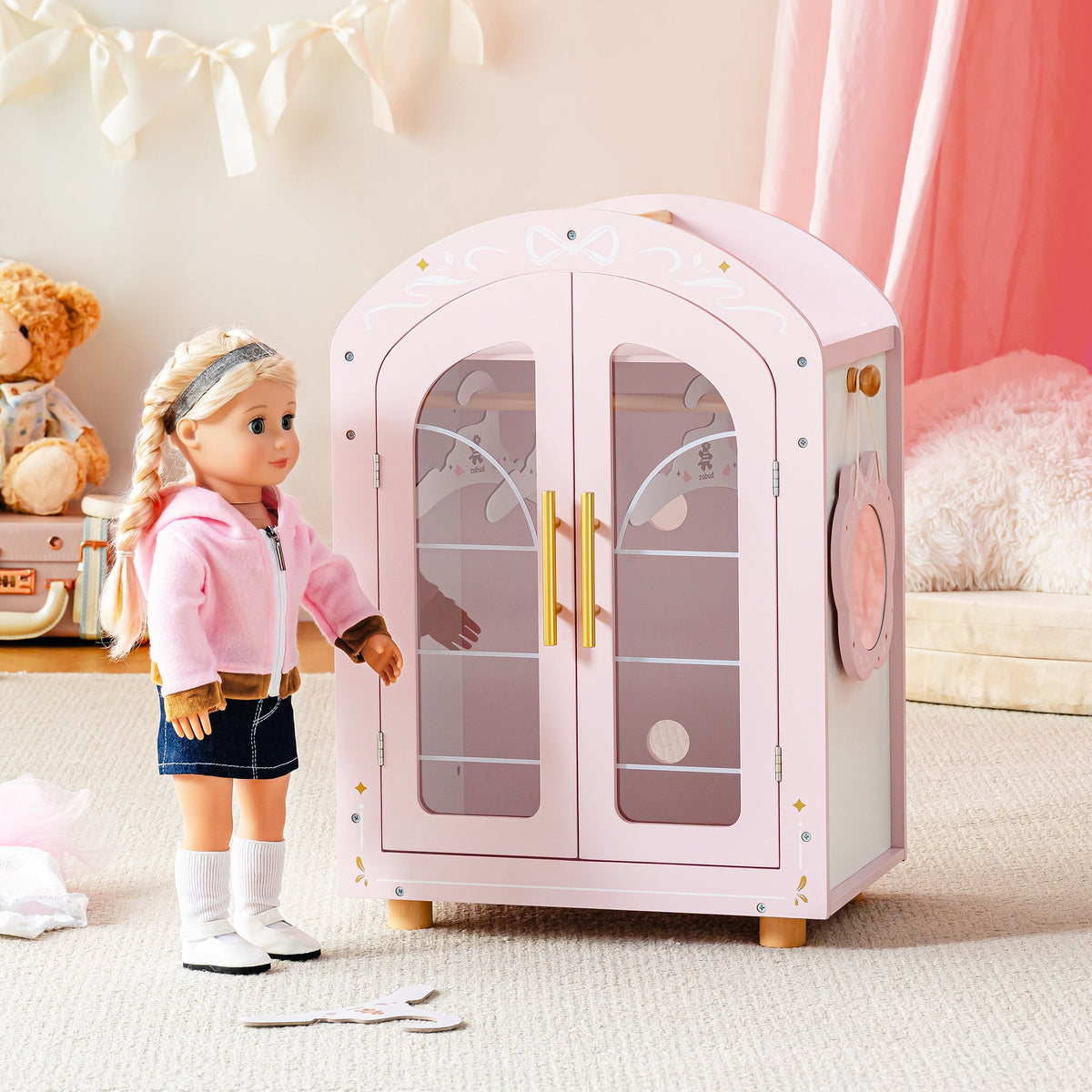 ROBUD pink arch-door doll wardrobe with a standing fashion doll beside it in a pink-toned lifestyle backdrop.