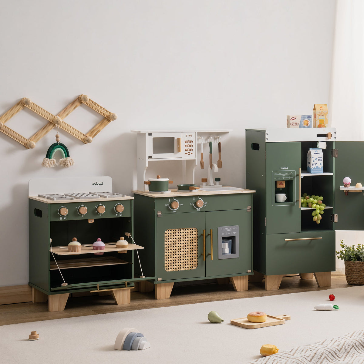 Full ROBUD vintage green 3-piece kitchen set displayed in a white room with scattered play food on a light wood floor