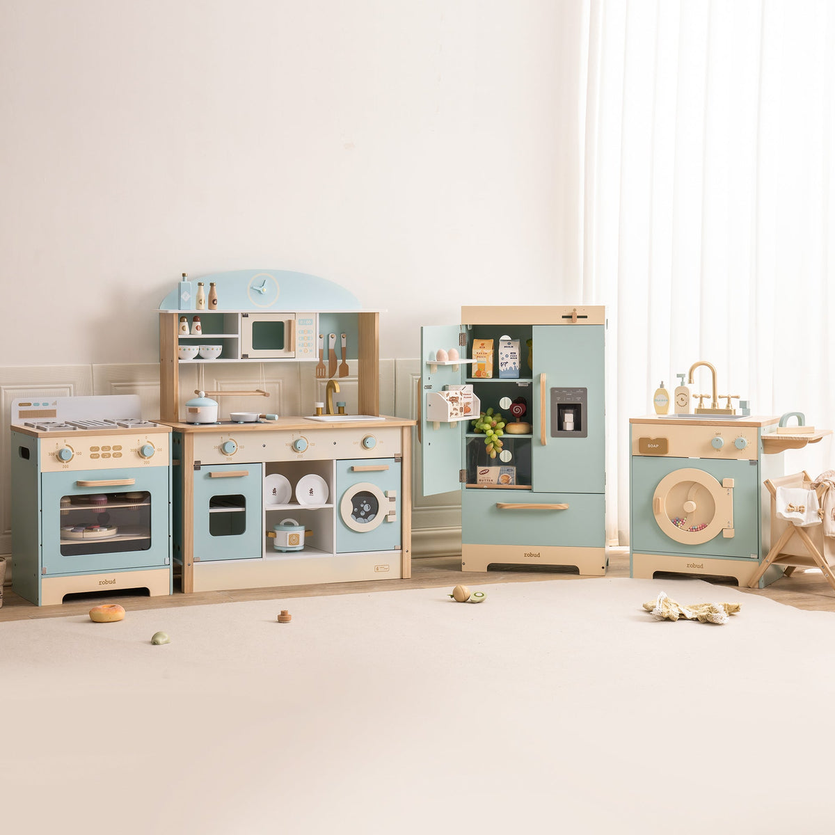 Robud green kitchen playset full collection in a soft-lit room with accessories arranged on pale floor