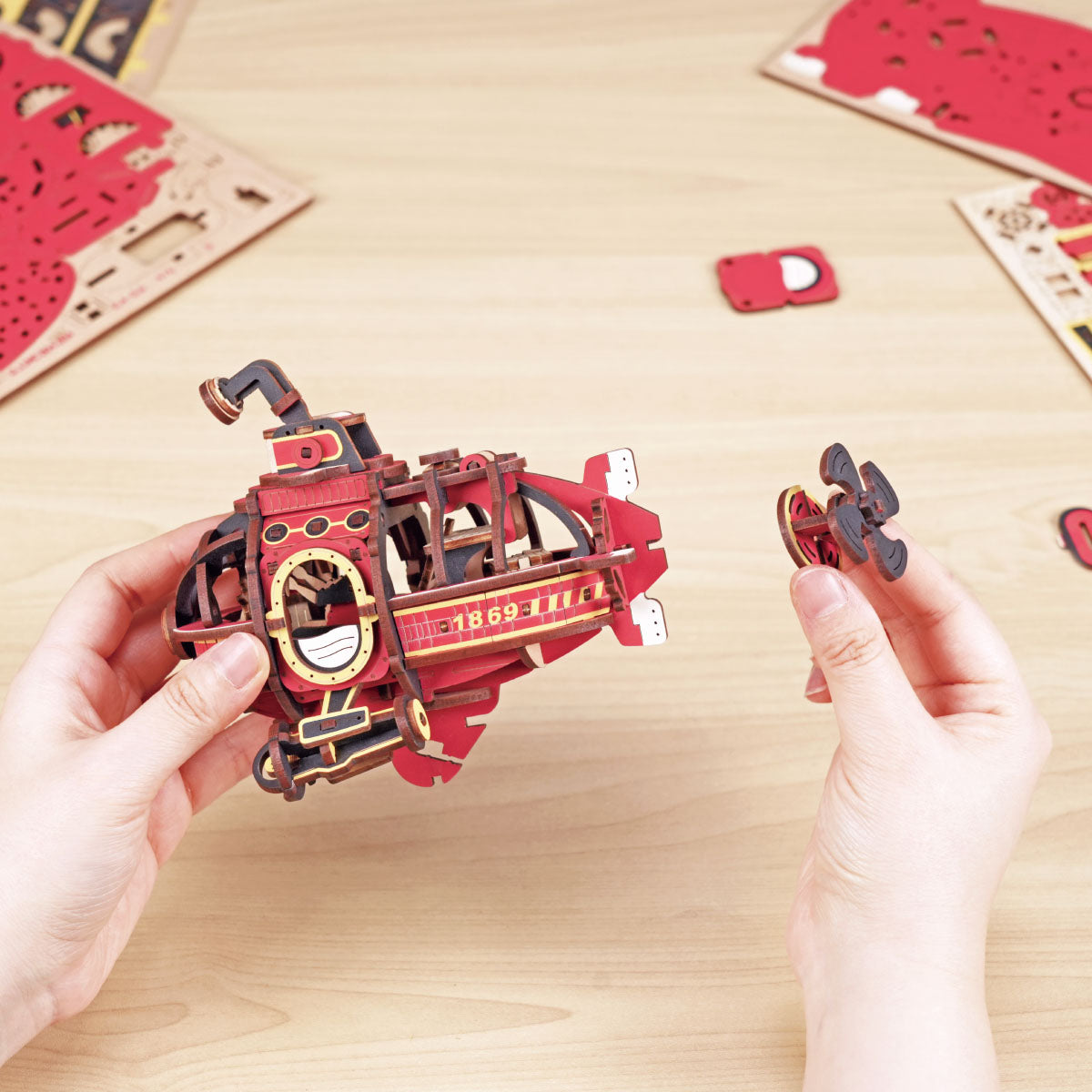 ROKR Deep-Sea Adventurer Gravity Swing MCD04 duplicate kraft box front and back packaging showing assembly diagram, 219 parts, and steampunk submarine artwork