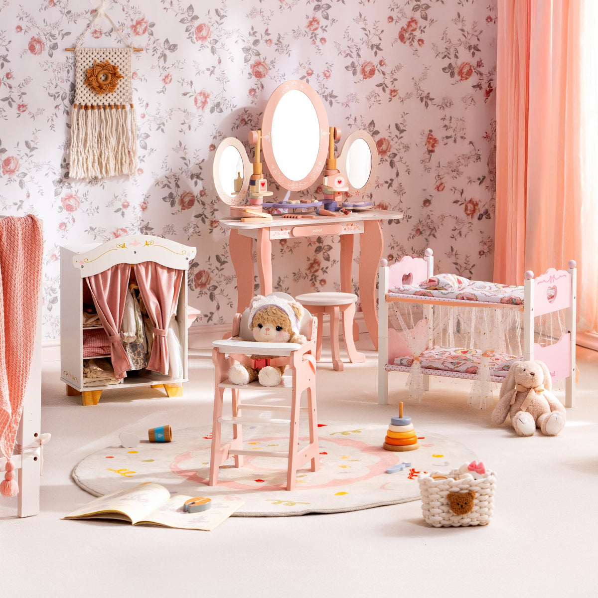 ROBUD princess play set arranged on a round rug with vanity pink wardrobe cradle and high chair in a floral room.