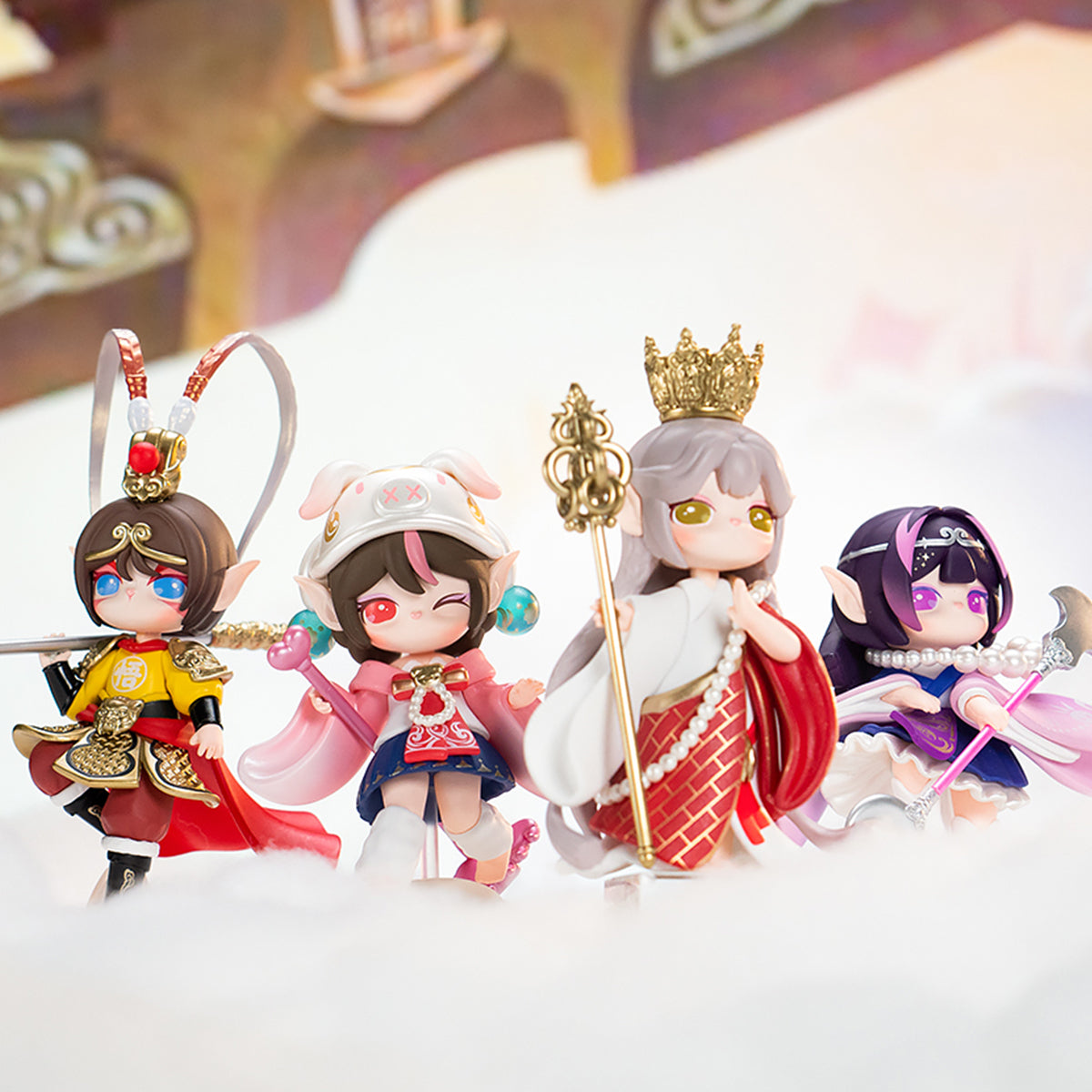Rolife Suri Journey to the West figures hang together with gold cords and pastel costumes.