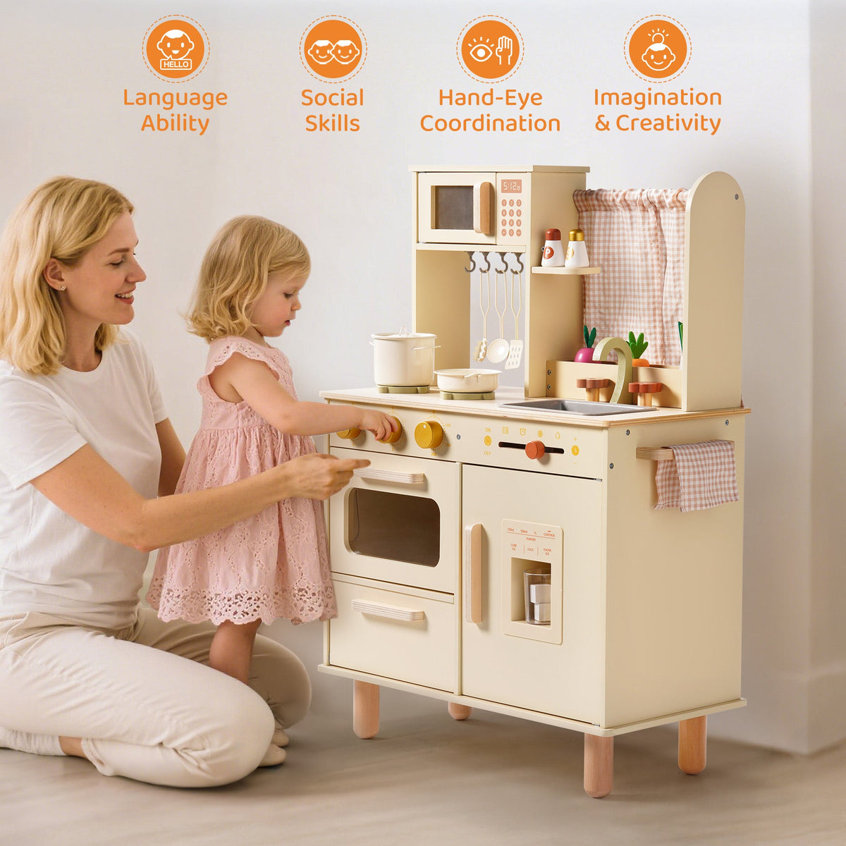 Mother and daughter play at the ROBUD cream wooden play kitchen, with icons for language, social, and creative skills.