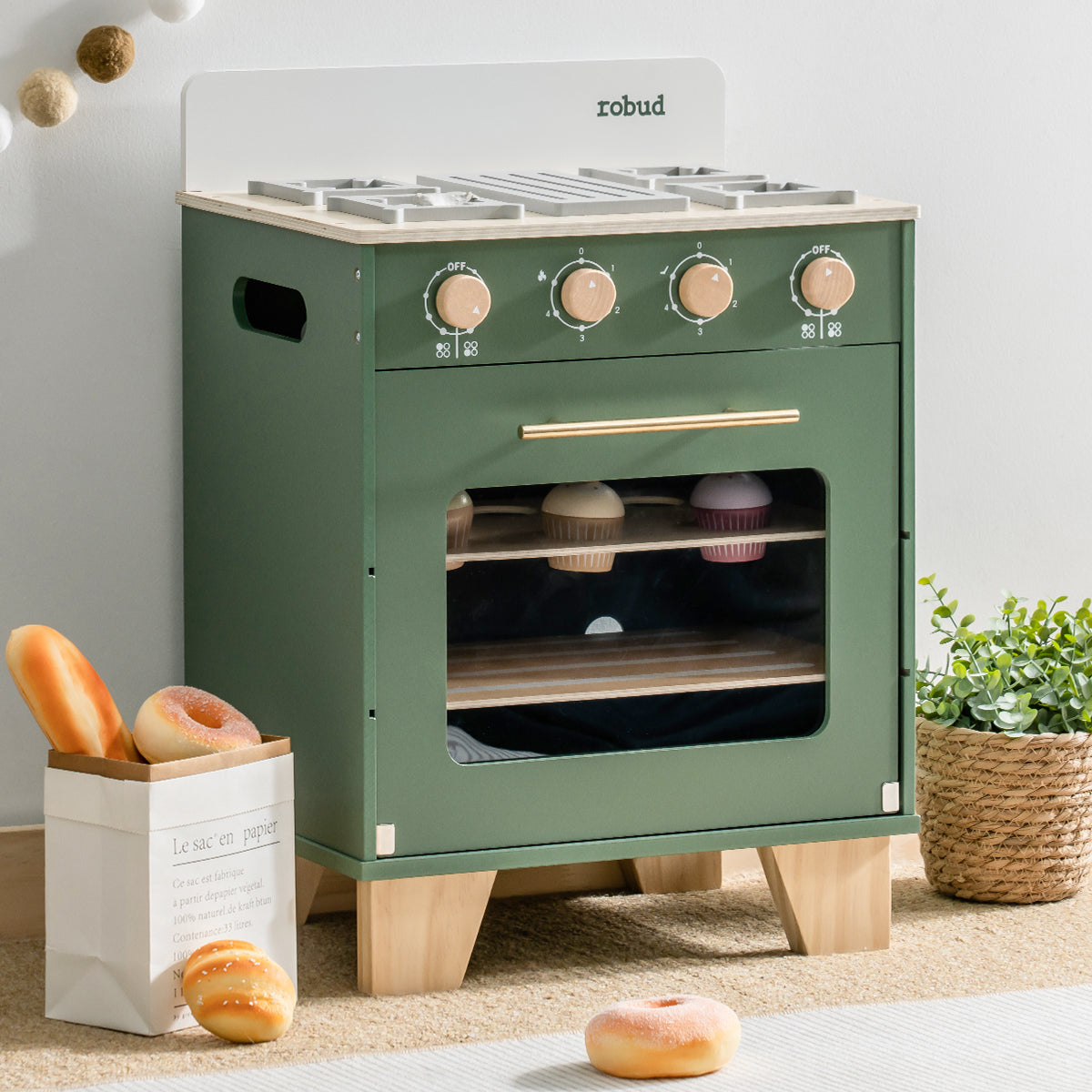 ROBUD vintage oven playset with open oven door showing interior rack and toy baguette loaves.