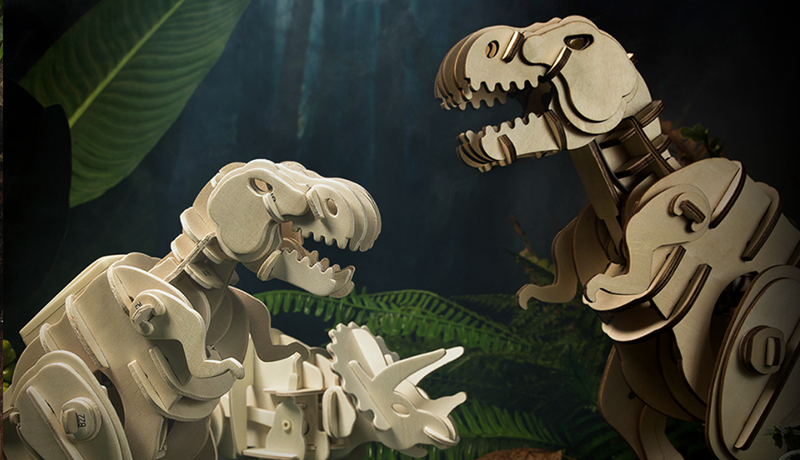 Robotime wooden dinosaur skeleton model posed with cream bones on a dark backdrop