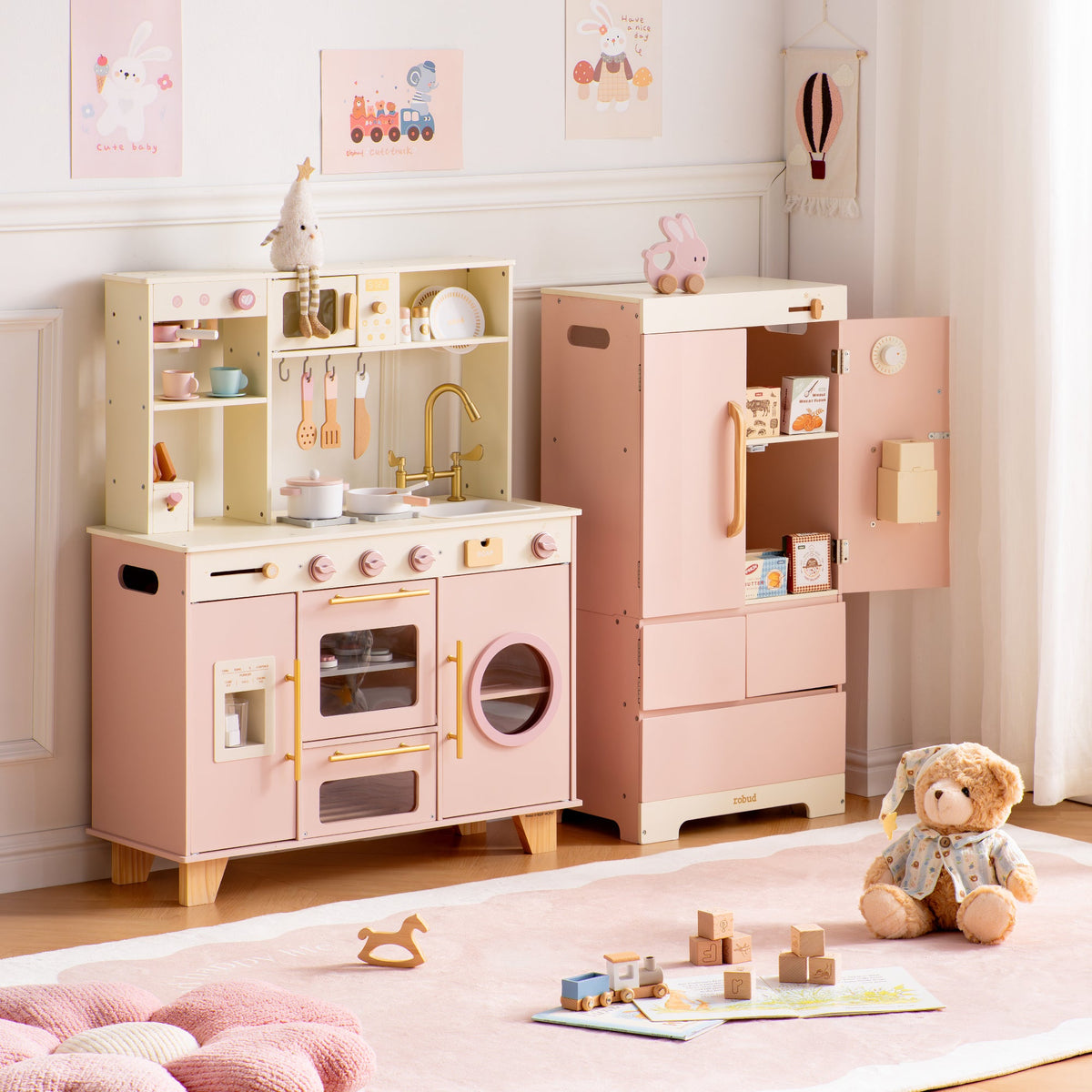 ROBUD Glowwood pink play kitchen and open refrigerator side by side, showing full storage and cooking area details.
