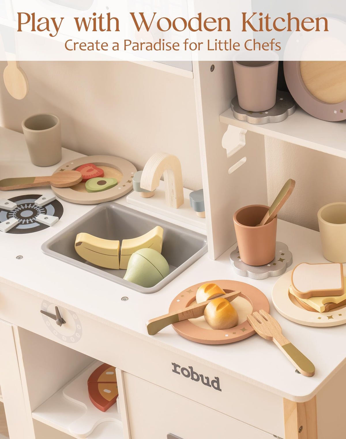 ROBUD wooden play dish set on white kitchen counter beside little chef paradise promotional banner