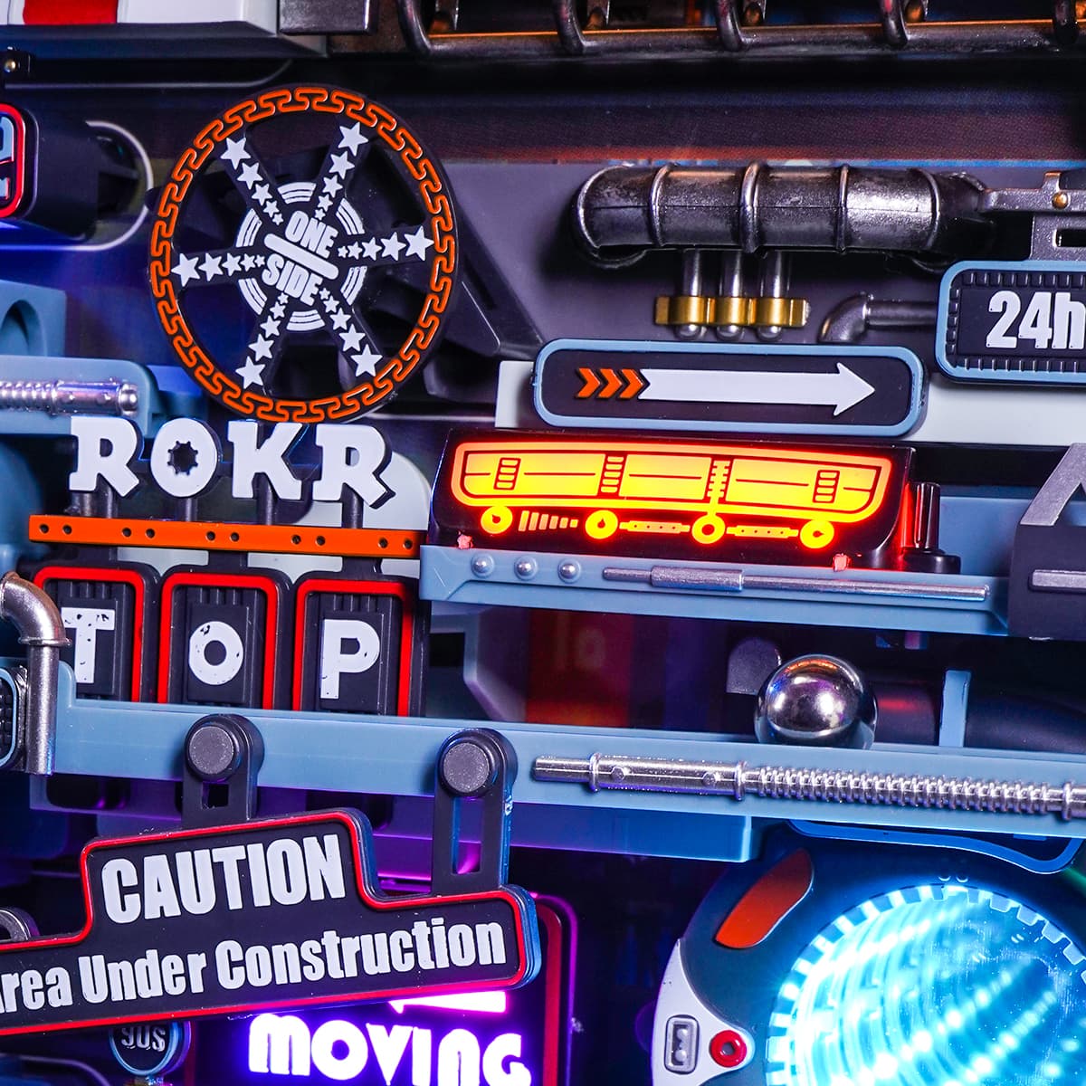 ROKR Last City control panel detail with gauge, arrows, warning labels, and blue light.