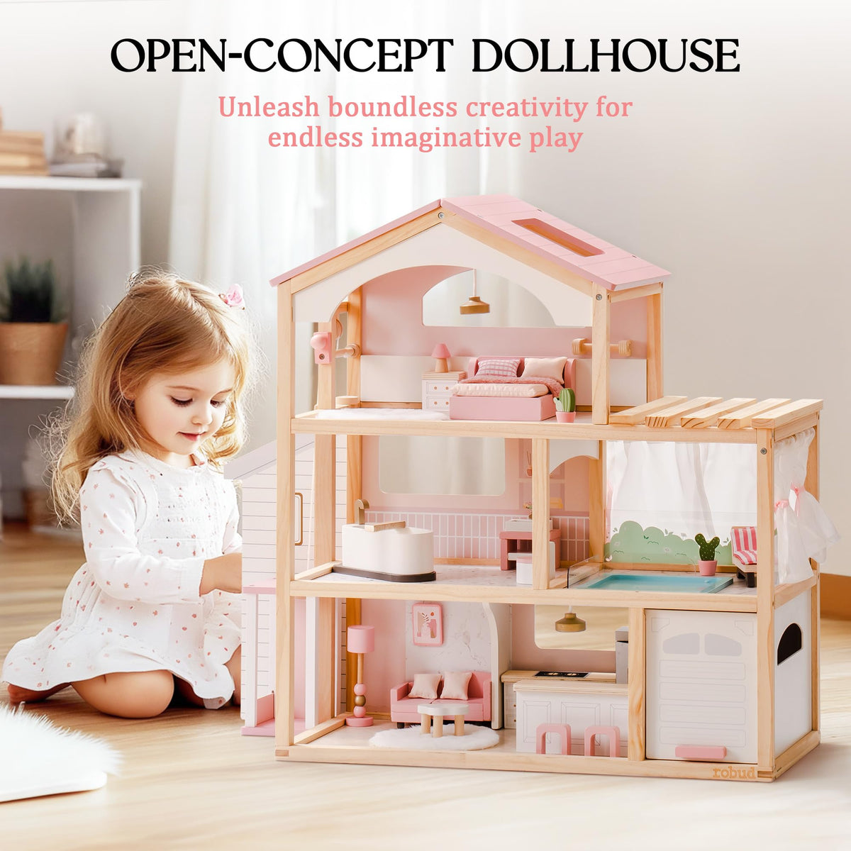 ROBUD open-concept dollhouse lifestyle shot with young girl beside three-story pink and wood structure