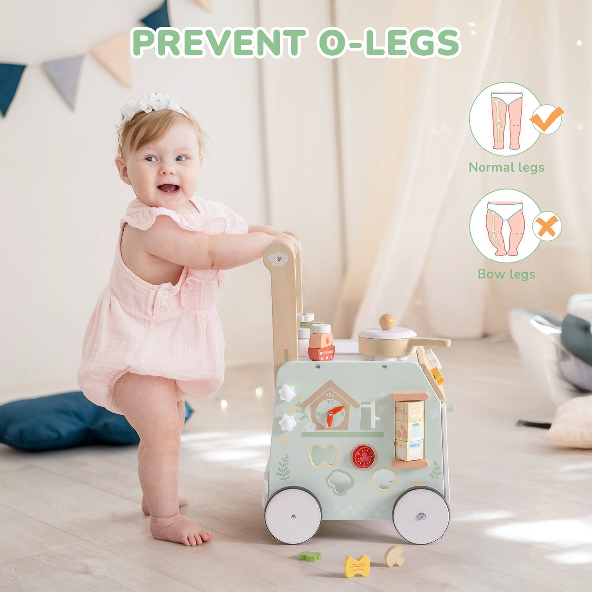 Smiling baby in pink romper pushing ROBUD Spring Countryside green wooden activity cart walker on a light wood floor