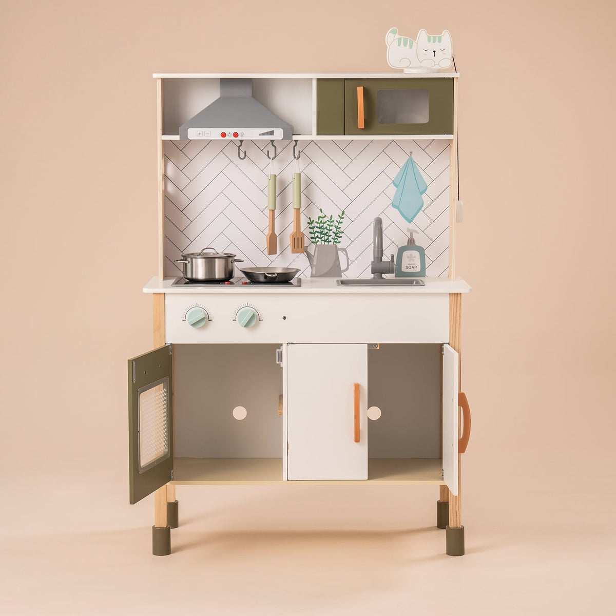 ROBUD wooden toddler play kitchen WG187 angled front view with sage green accents, oven door and copper handle detail