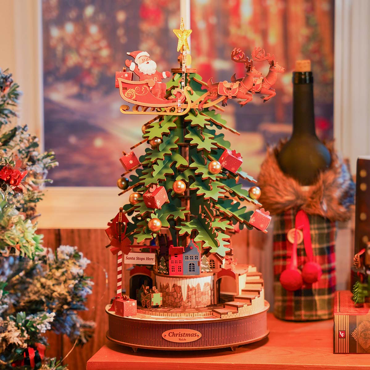 Rolife Christmas Melody Tree AMS01 white-background front view of the fully assembled rotating tree with Santa sleigh reindeer and glowing lights