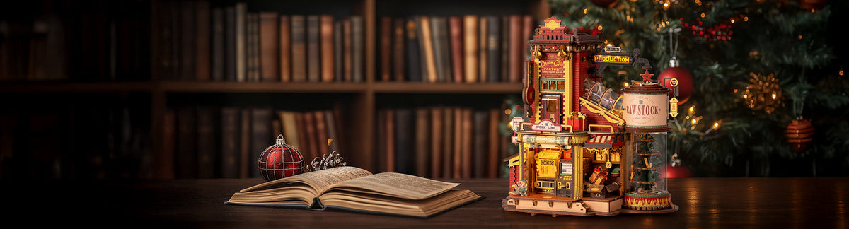 Robotime Magic Amusement Park collection desktop hero banner showing Dream Gift Factory EAB01 music box beside Christmas tree