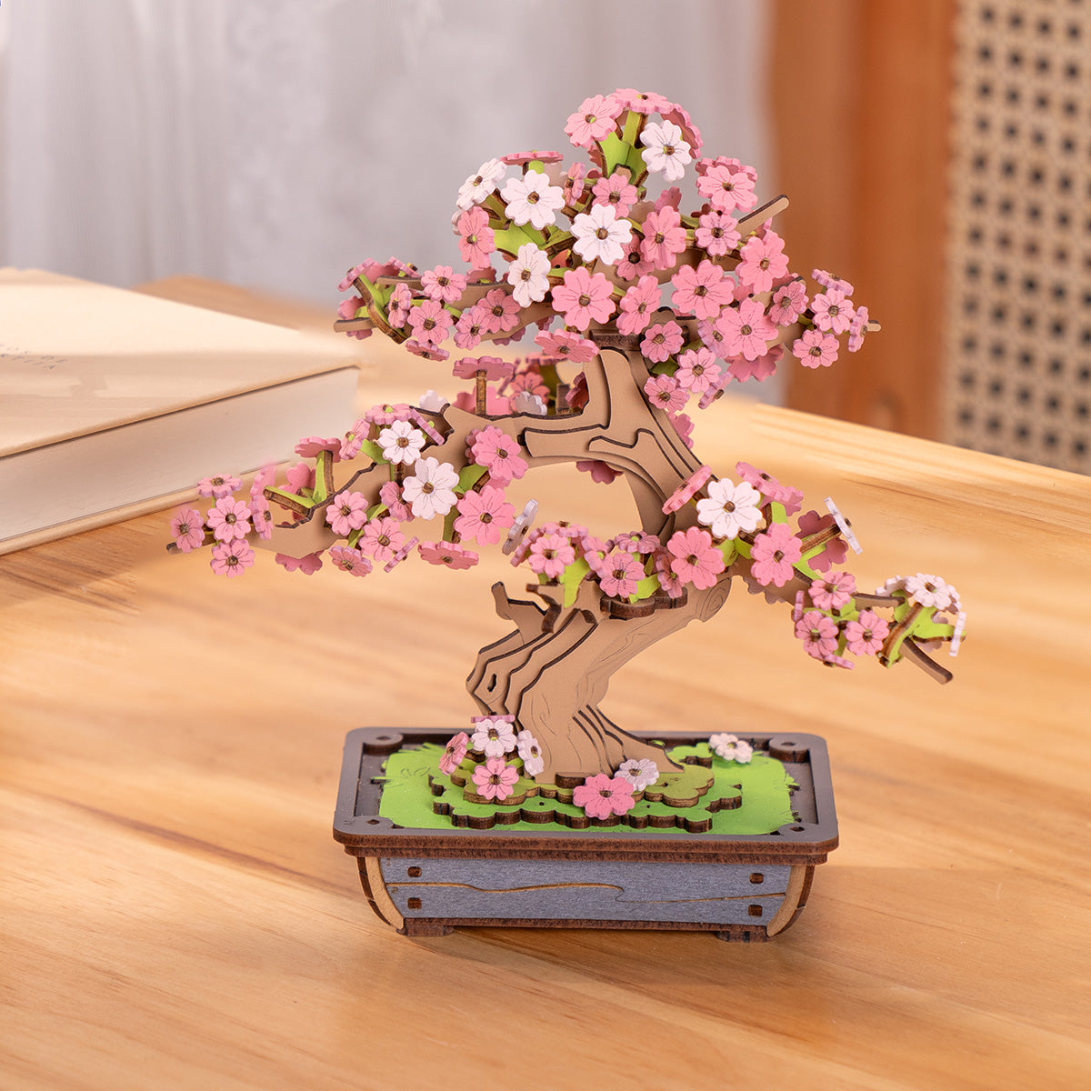 Rolife Sakura Bonsai TG415 front view with pink cherry blossoms and brown curved trunk on green grass base