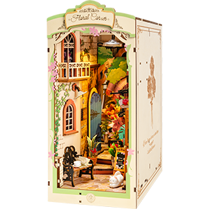 A Rolife Floral Corner book nook shelf insert kit TGB09 showing a lush garden scene with archway, cat, and blooming flowers displayed as a standalone product