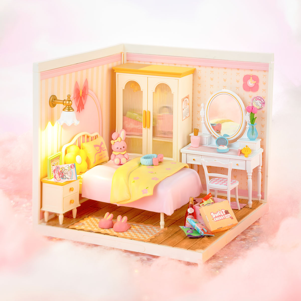 Rolife Lovely Pink Bedroom DIY miniature house DW016 top-down overhead view displaying the full room layout with pink bed, cream wardrobe, white vanity table, and bow-patterned wallpaper.