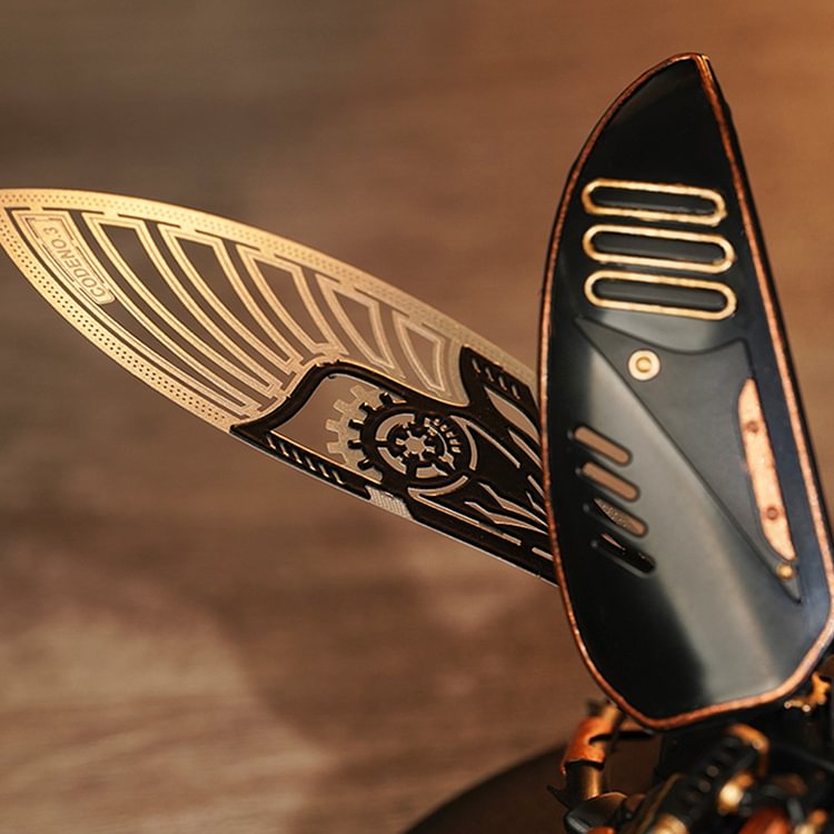 ROKR Storm Beetle MI03 close-up of spread wings with engraved circuit pattern and ribbed stripes