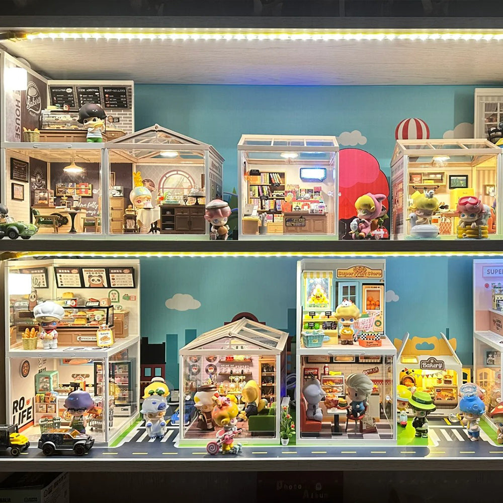 Rolife Super Creator backlit display shelf with glowing miniature shop dioramas and small figurines arranged across multiple levels.